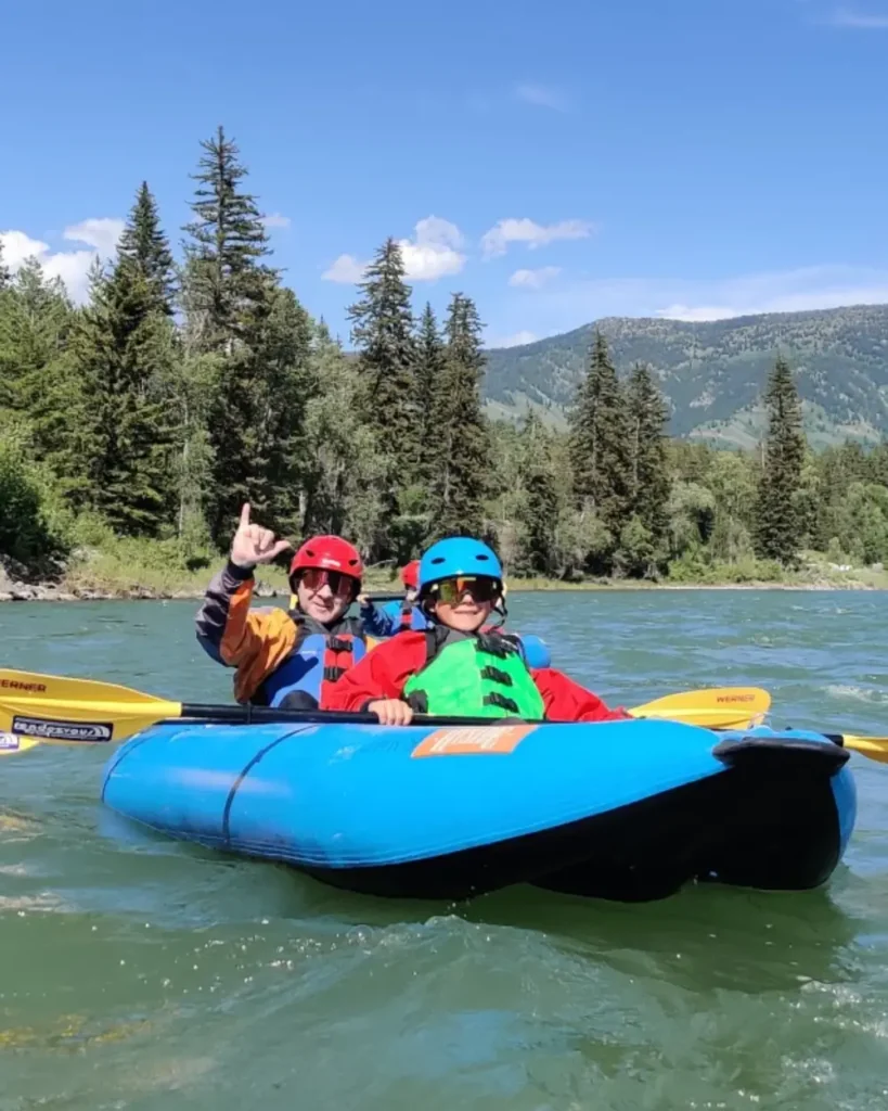 Yellow paddle and blue raft or floating platform in Snake River.