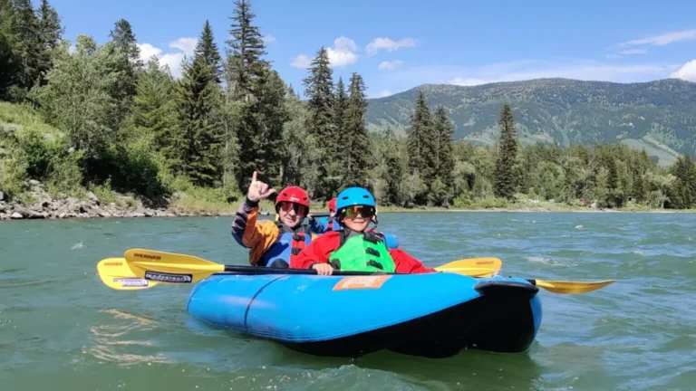 Yellow paddle and blue raft or floating platform in Snake River.